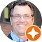 Person with glasses and location pin icon