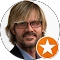 Bearded man with glasses and orange star icon