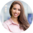 Smiling woman in pink blouse at office
