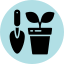 Gardening trowel and plant icon in blue circle